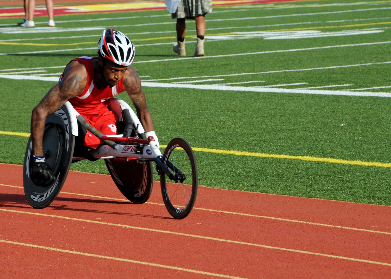 Retired Marine Corps Cpl. Anthony McDaniel takes the lead in the men's 800-meter wheelchair race during the 2015 DoD Warrior Games at Marine Corps Base Quantico, Va., June 23, 2015. He earned a gold medal in the men's 100-meter and 800-meter wheelchair events. DoD photo by Shannon Collins