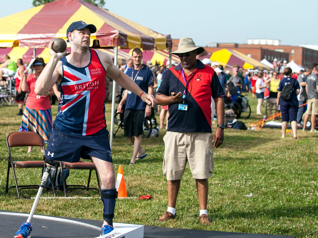 British army veteran Sapper Andrew Roberts throws the shot put during field competition for the 2015 Department of Defense Warrior Games on Marine Corps Base Quantico, Va., June 23, 2015.