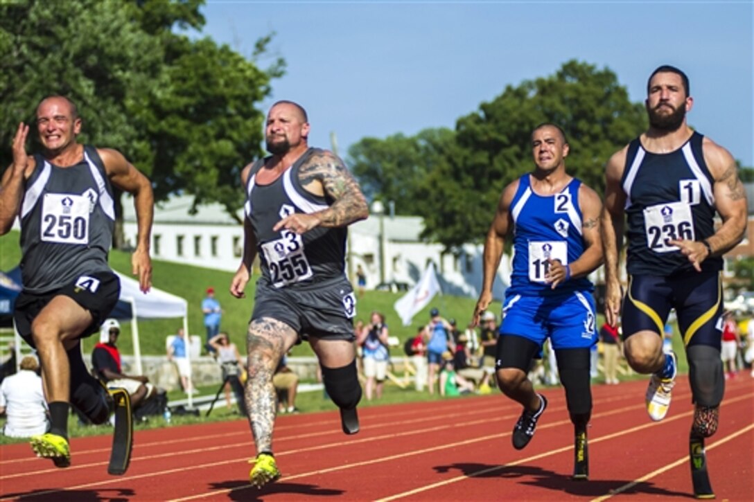 U.S. and British athletes compete in the 100-meter sprint at the 2015 Department of Defense Warrior Games on Marine Corps Base Quantico, Va., June 23, 2015.