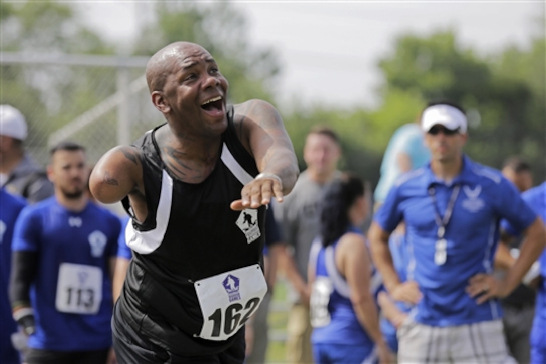 U.S. Army Sgt. 1st Class Michael Smith puts all his energy into his second throw of the day during the men's shot put competition at the 2015 Department of Defense Warrior Games on Marine Corps Base Quantico, Va., June 23, 2015.