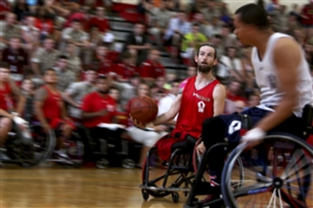 Marine Corps veteran Ray Hennagir prepares to shoot the ball during the wheelchair basketball championship game on Marine Corps Base Quantico, Va., June 23, 2015. Hennagir is a member of the 2015 Department of Defense Warrior Games All-Marine Team
