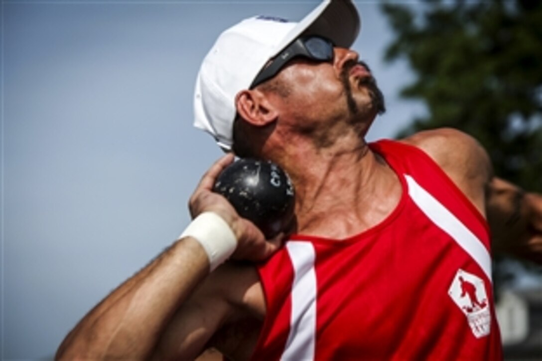 Marine Corps veteran Adam Vickery prepares to throw a shot during the field competition of the 2015 DOD Warrior Games on Marine Corps Base Quantico, Va., June 23, 2015. 