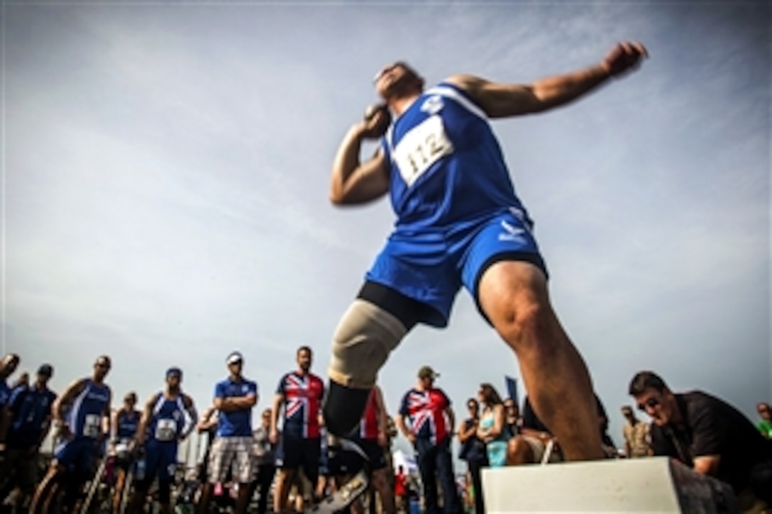 Air Force Tech. Sgt. Jason Caswell throws the shot put during field competition for the 2015 DOD Warrior Games on Marine Corps Base Quantico, Va., June 23, 2015.