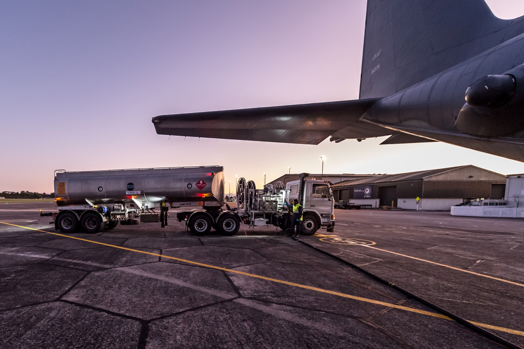 A Royal New Zealand Air Force tanker refuels a 1st Special Operations Squadron MC-130H Combat Talon II aircraft on the flight line at RNZAF Base Auckland, New Zealand, June 16, 2015.  Members from the 353rd Special Operations Group and the Royal New Zealand Air Force and Army are participating in Exercise Flash Lantern Net June 18-27 at RNZAF Base Auckland in New Zealand.   (New Zealand Defense Force photo by Roderick Mackenzie\Released)
