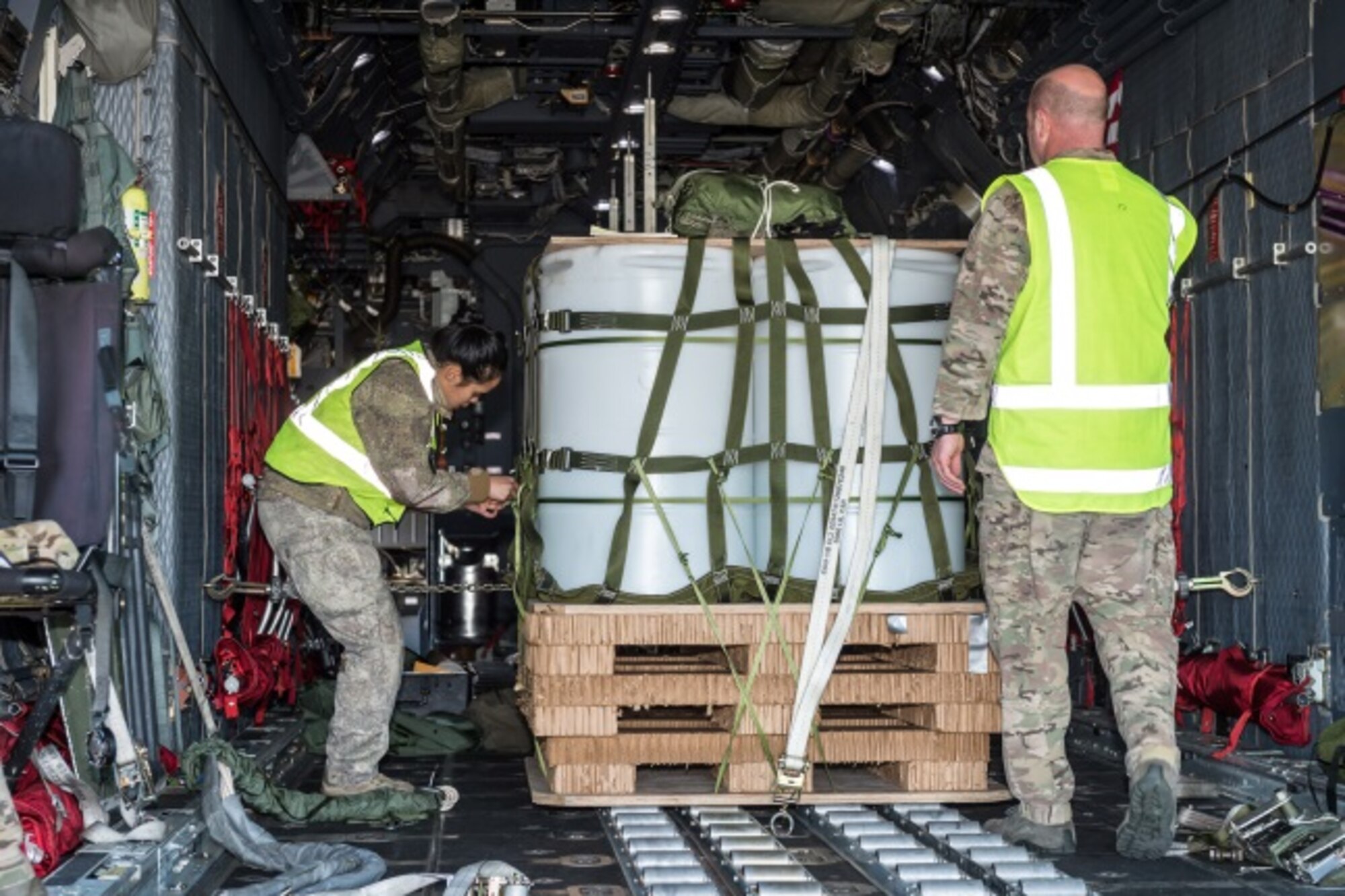 New Zealand Army Lance Corporal Powhiri Mete (left) checks a Container Delivery System (CDS) pallet loaded on board a 1st Special Operations Squadron MC-130H Combat Talon II aircraft June 22, 2015 at Whenuapai, New Zealand, during Exercise Flash Lantern Net.  Members from the 353rd Special Operations Group and the Royal New Zealand Air Force and Army are participating in Exercise Flash Lantern Net June 18-27 at Royal New Zealand Air Force Base Auckland in New Zealand.  (New Zealand Defense Force photo by Roderick Mackenzie)
