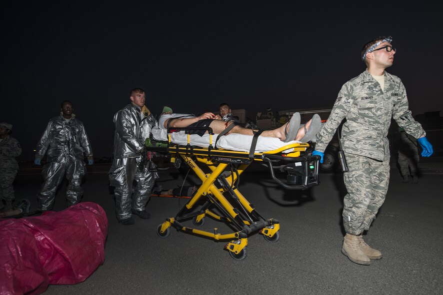First responders transport a patient to a nearby ambulance during an active shooter scenario June 19, 2015 at Al Udeid Air Base, Qatar. Several agencies were tested on their reaction to respond to the scenario to make sure they were properly trained to react to any scenario that might occur on base. (U.S. Air Force photo by Tech. Sgt. Rasheen Douglas)