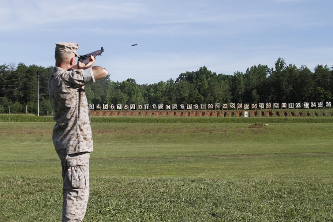 Lieutenant Gen. Mark A. Brilakis, Commanding General, Marine Corps Recruiting Command, fired the first round during the opening ceremony at the 54th Interservice Rifle Championship held at the Calvin A. Lloyd Complex, Quantico, Va., June 24, 2015. The competition is hosted by Weapons Training Battalion and is scheduled to run from June 24 to July 1. The event includes various individual and team competitions. The awards banquet announcing the winners will take place on July 1 at the Clubs at Quantico.