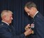 Maj. Gen. Craig Gourley (right) receives the Legion of Merit award from Maj. Gen. (ret) James Sluder, long time friend and comrade-in-arms, June 5 at the Naval Air Station Fort Worth Joint Reserve Base, Texas. Gourley served as the Deputy Inspector General of the Air Force, Office of the Secretary of the Air Force, Washington, D.C. Prior to that he was the vice commander for Air Force Reserve Command at Robins Air Force Base, Ga. He retired after 37 years of service to his country. (U.S. Air Force photo by Master Sgt. Julie Briden-Garcia)