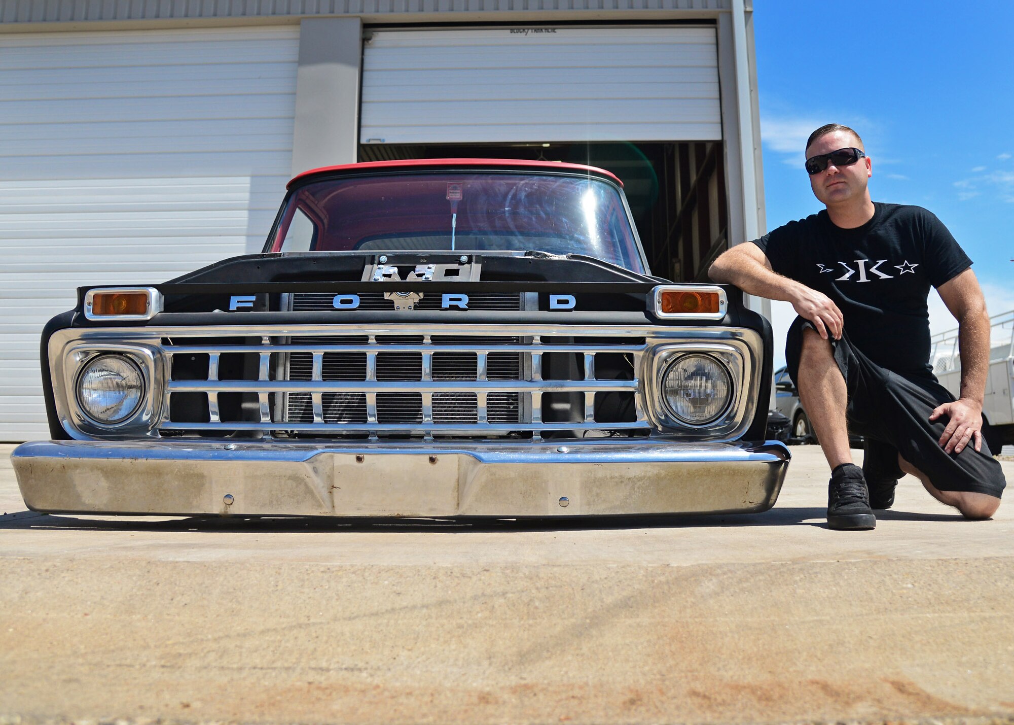 U.S. Air Force Staff Sgt. Tom Sieben, 727th Special Operations Aircraft Maintenance Squadron combat oriented supply operations, poses with his 1965 Ford F-100 pick-up truck June 19, 2015 in Clovis, N.M. Sieben has restored and transformed the vehicle in preparation for the 2nd Annual “Draggin’ Main” event June 27. (U.S. Air Force photo/Senior Airman Chip Slack) 