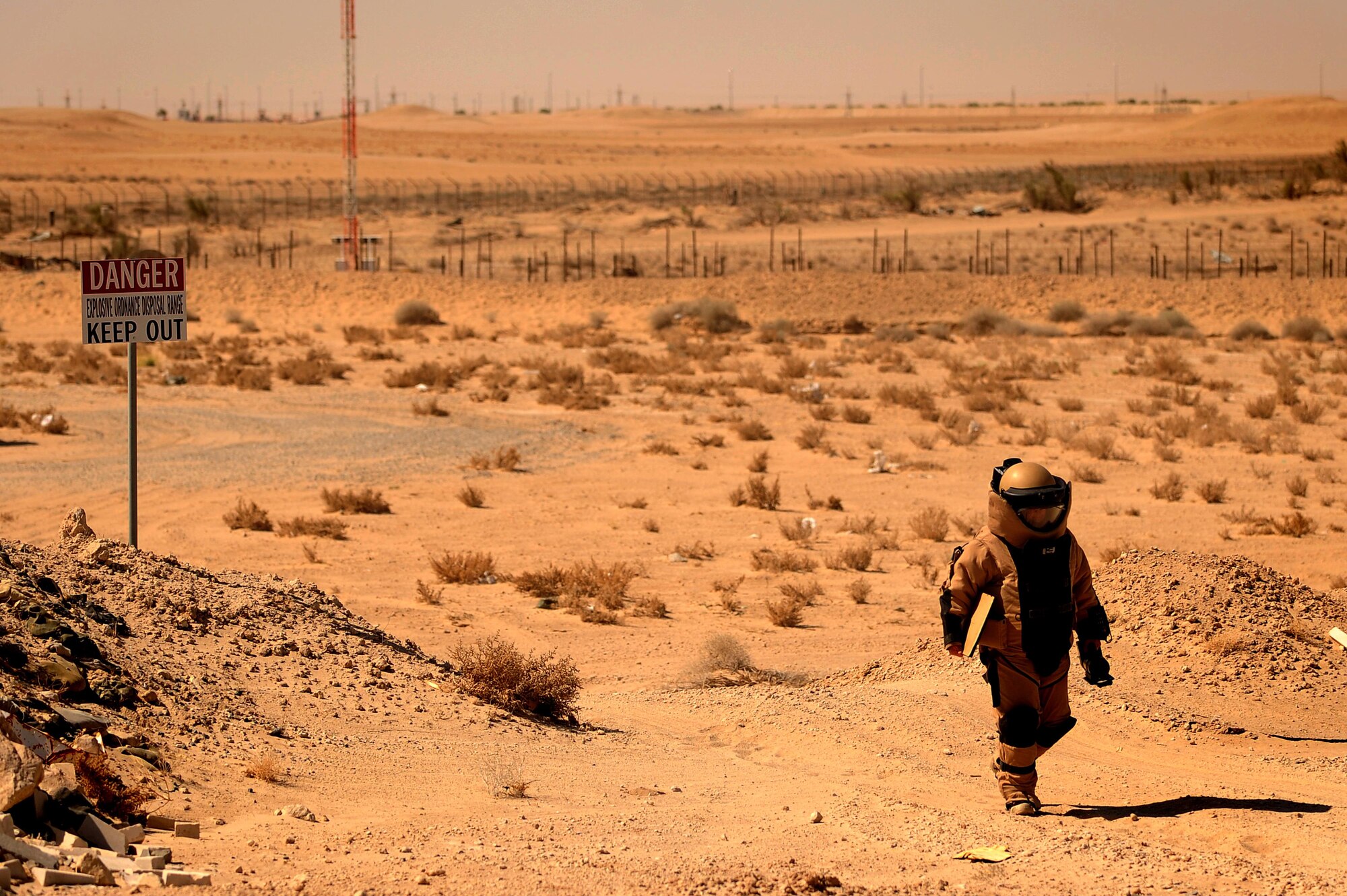 Tech. Sgt. Matthew Bingaman, 386th Expeditionary Civil Engineer Squadron explosive ordnance disposal technician, returns from a manual approach to an improvised explosive device training scenario at an undisclosed location in Southwest Asia, June 25, 2015. Even as a 16-year EOD veteran, Bingaman continually trains to safely handle live explosives. (U.S. Air Force photo/Tech. Sgt. Brittany E. Jones)