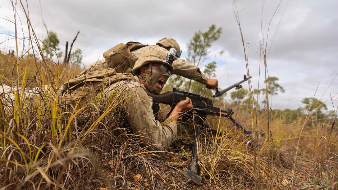 “Gun one barrel change!” yells U.S. Marine Corps Lance Cpl. Tyler Partanen during a brigade assault as part of Exercise Southern Jackaroo 2015 June 13 at Townsville Field Training Area, Queensland, Australia. SJ15 was a combined training opportunity for the Marines with Marine Rotational Force – Darwin and their Australian allies that helped to improve interoperability between the two forces. The U.S. Marine Corps and the Australian Defense Forces are committed to continuing their tradition of more than 100 years of global partnership and security cooperation between Australia and the United States of America. Partanen is a machine gunner with Company C, 1st Battalion, 4th Marine Regiment, MRF-D. 