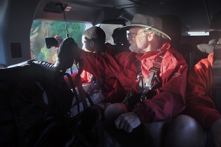 Members of a Boy Scout group from Louisiana who were stranded by floodwaters in a remote section of the Ouachita National Forest in southwest Arkansas enjoy the view from an Arkansas National Guard helicopter that rescued them early Tuesday, May 3, 2011. The six Scouts and two adult leaders had been stranded without communications since Sunday.