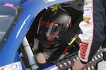 Dale Earnhardt Jr. driver of the No. 88 National Guard NASCAR racecar, checks his gauges moments before the race at Richmond International Raceway in Richmond, Va., April 30, 2011. Jr. looked promising the day before during practice, but started the race in the 24th position and would struggle all night to cross the finish line in 19th.