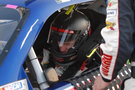 Dale Earnhardt Jr. driver of the No. 88 National Guard NASCAR racecar, checks his gauges moments before the race at Richmond International Raceway in Richmond, Va., April 30, 2011. Jr. looked promising the day before during practice, but started the race in the 24th position and would struggle all night to cross the finish line in 19th.