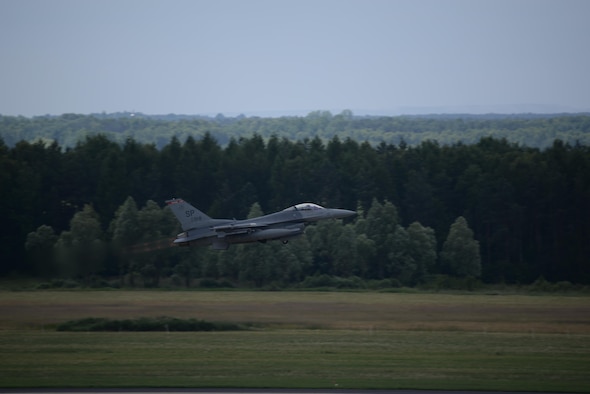 An F-16 Fighting Falcon takes off in support of NATO exercise Eagle Talon June 15, 2015. Forces from the South Carolina Air National Guard’s 52nd Fighter Wing and the 32nd Tactical Wing from Poland focused on offensive air operations and command and control exercises. The training missions paired U.S. fighter pilots and maintenance crews with their Polish Air Force counterparts at Lask Air Base, Poland, and helped strengthen relationships. (U.S. Air Force photo/Senior Master Sgt. Wesley Fleming )