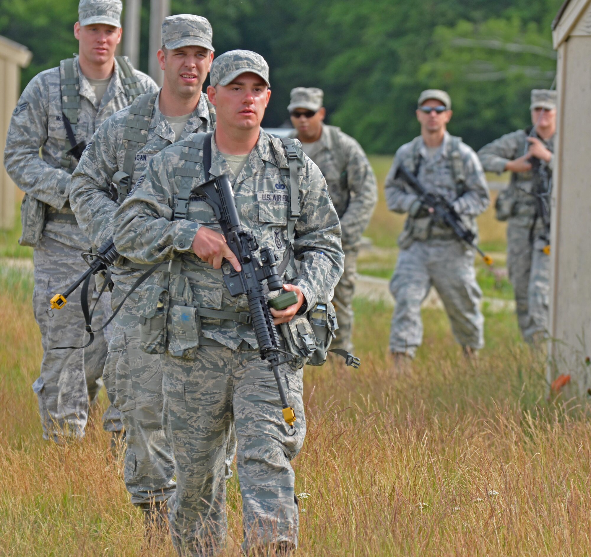 Members of the 439th Security Forces Squadron participate in a tactical training exercise June 19. Westover's Dogpatch training area functioned as a mock air base. The training was designed to remind the Airmen of being prepared for approaching deployments for many Westover units. (U.S. Air Force photo by MSgt. Andrew Biscoe/Released).