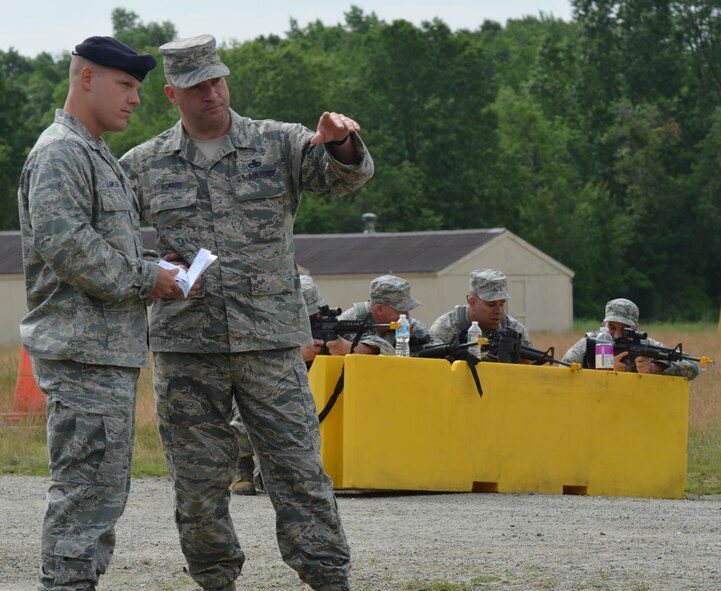 Maj. Bruce Lawler, left, listens as Senior Master Sgt. Daniel Howard, 439th Security Forces Squadron first sergeant, explains an exercise scenario. Security Forces Airmen took part in a tactical exercise June 19 at Westover. (U.S. Air Force photo by Master Sgt. Andrew Biscoe/Released).