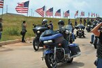 Master Sgt. Dustin Hoffmann, 502nd Contracting Squadron superintendent of the medical and civil engineering services flight, (front); participated with the Fallen Saints Motorcycle Club in the inaugural Heritage Ride June 13. The concept of the three-hour ride was to raise awareness about the Airman Heritage Museum. Hoffman, along with Tech. Sgt. Ruben Gonzalez, 502nd CONS contracting officer of basic construction flight, founded the club in 2013. (U.S. Air Force photo/Jose T. Garza III)