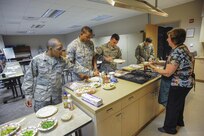 Veteran chef Dianna Ackerley (right), teaches Joint Base San Antonio-Randolph Airmen healthy cooking habits on a budget while making sandwich wraps and pasta salads during the Kitchen Addiction cooking class at the Joint Base San Antonio-Randolph Human Performance Resource Center.