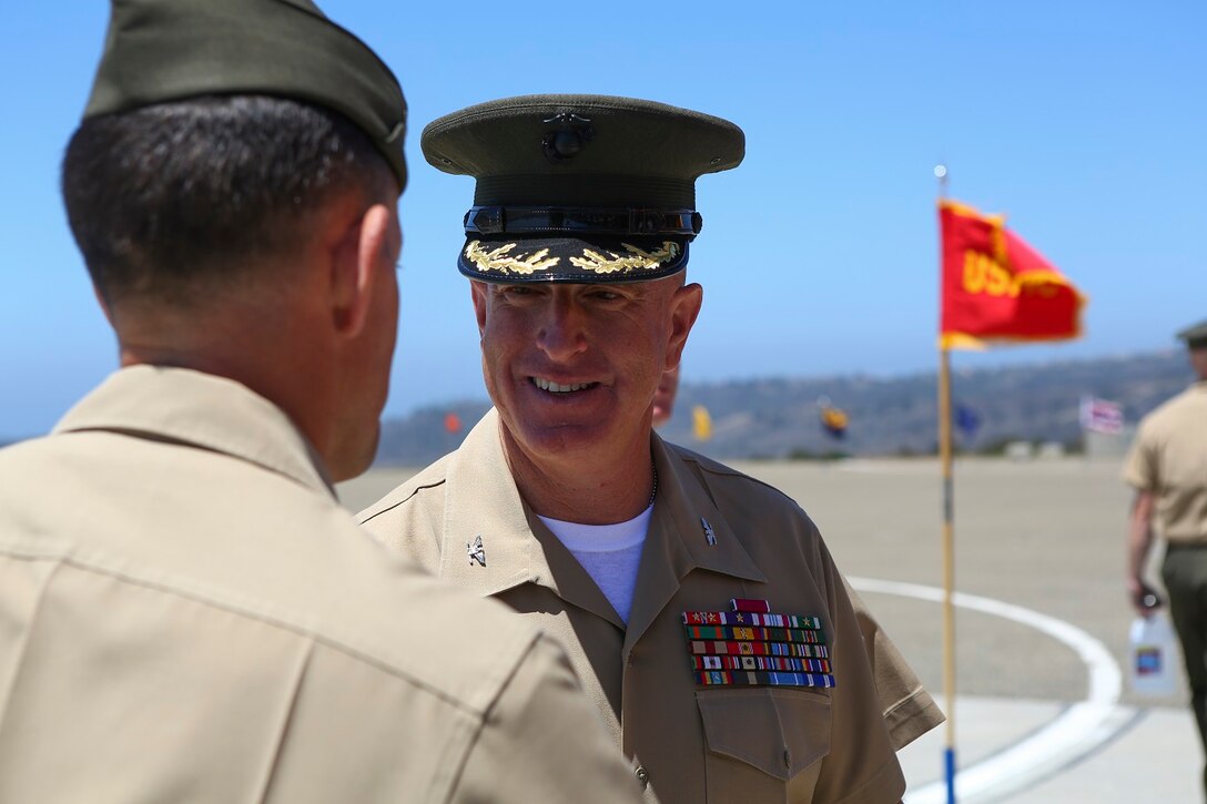 Colonel Kenneth R. Kassner is congratulated by Marines and Sailors after taking command of the 5th Marine Regiment from Col. Jason Q. Bohm aboard Marine Corps Base Camp Pendleton, Calif., June 24, 2015. Kassner most recently served as the assistant chief of staff, programming and requirements, U.S. Marine Corps Forces Special Operations Command.