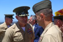 Colonel Jason Q. Bohm is congratulated by Marines and Sailors after relinquishing his role as the commanding officer of the 5th Marine Regiment to Col. Kenneth R. Kassner aboard Marine Corps Base Camp Pendleton, Calif., June 24, 2015. Kassner most recently served as the assistant chief of staff, programming and requirements, U.S. Marine Corps Forces Special Operations Command.