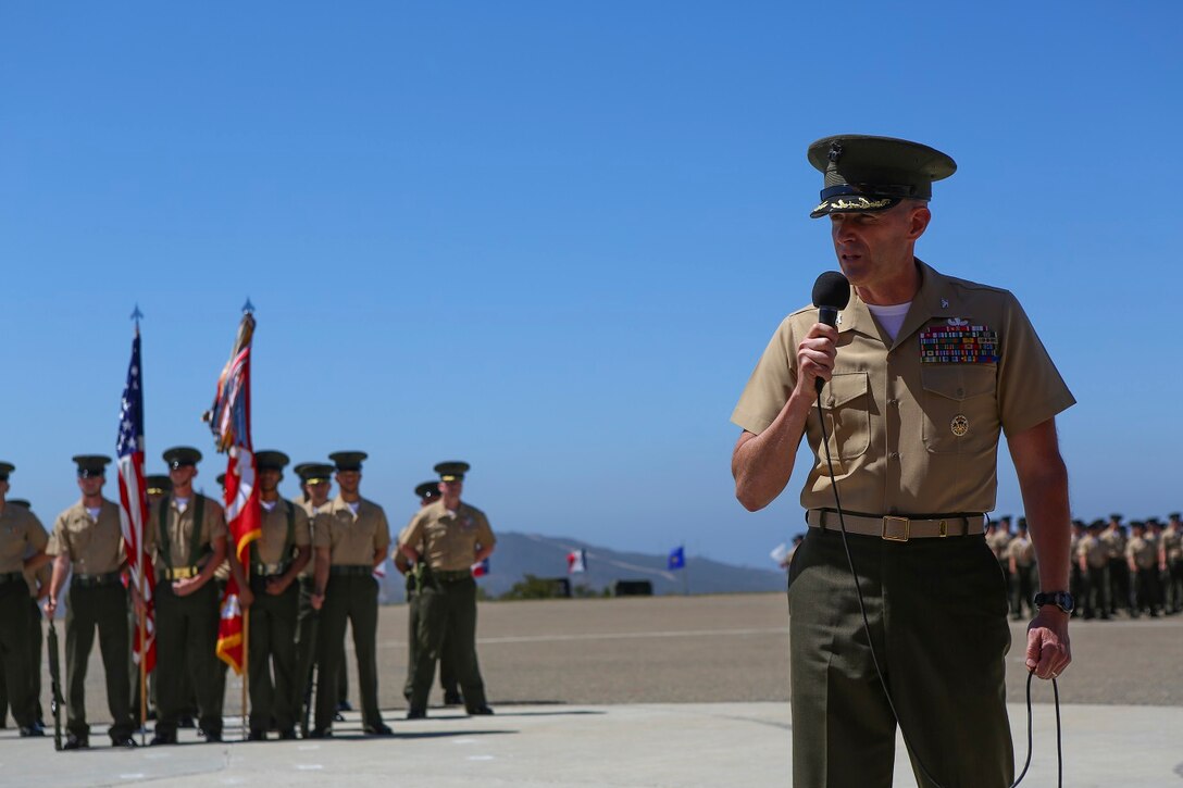 Colonel Jason Q. Bohm speaks after relinquishing his role as the commanding officer of the 5th Marine Regiment to Col. Kenneth R. Kassner aboard Marine Corps Base Camp Pendleton, Calif., June 24, 2015. Kassner most recently served as the assistant chief of staff, programming and requirements, U.S. Marine Corps Forces Special Operations Command.