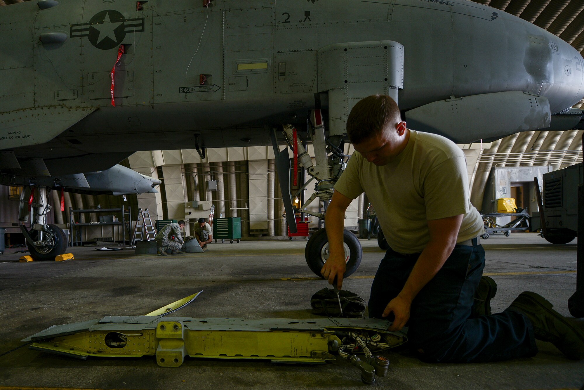 Staff Sgt. Christopher Simison, 25th Aircraft Maintenance Unit weapons load team chief, works on a pylon before installing it onto an A-10 June 22, 2015, at Osan Air Base, Republic of Korea. The pylons are required to be placed on the plane symmetrically to even out the balance of weight, ennabling the aircraft to fly steady. (U.S. Air Force photo by Staff Sgt. Jake Barreiro/Released)