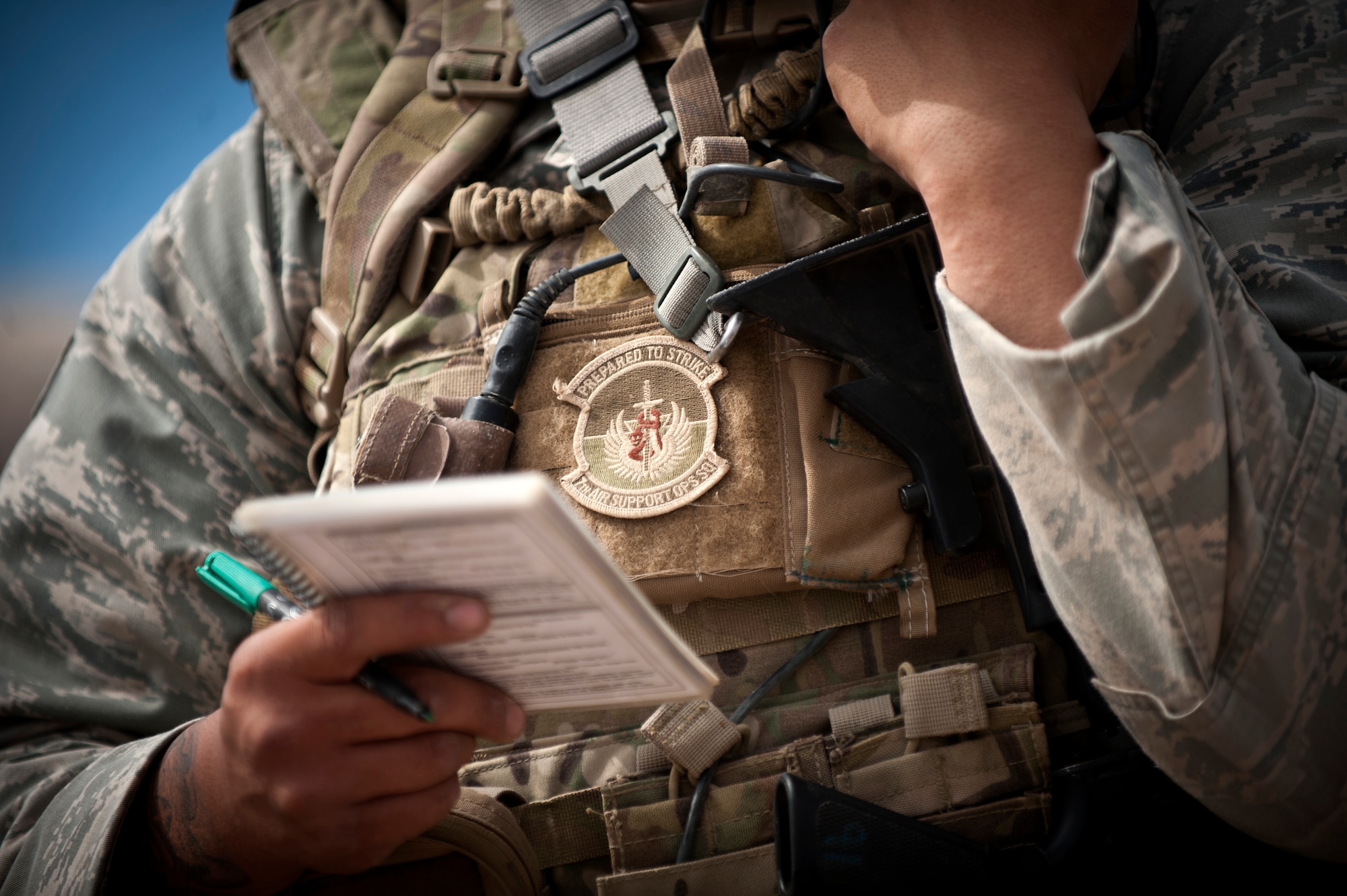 A joint terminal attack controller from the 7th Air Support Operations Squadron, Fort Bliss, Texas, directs aircraft to simulated enemy targets through his radio during a Green Flag 15-08 training scenario at the National Training Center, Fort Irwin, Calif., June 12, 2015. Attached to joint service ground combat units, it is the JTAC’s responsibility to safely and effectively direct airpower to meet the needs of a ground commander in stressful situations. (U.S. Air Force photo by Senior Airman Joshua Kleinholz)