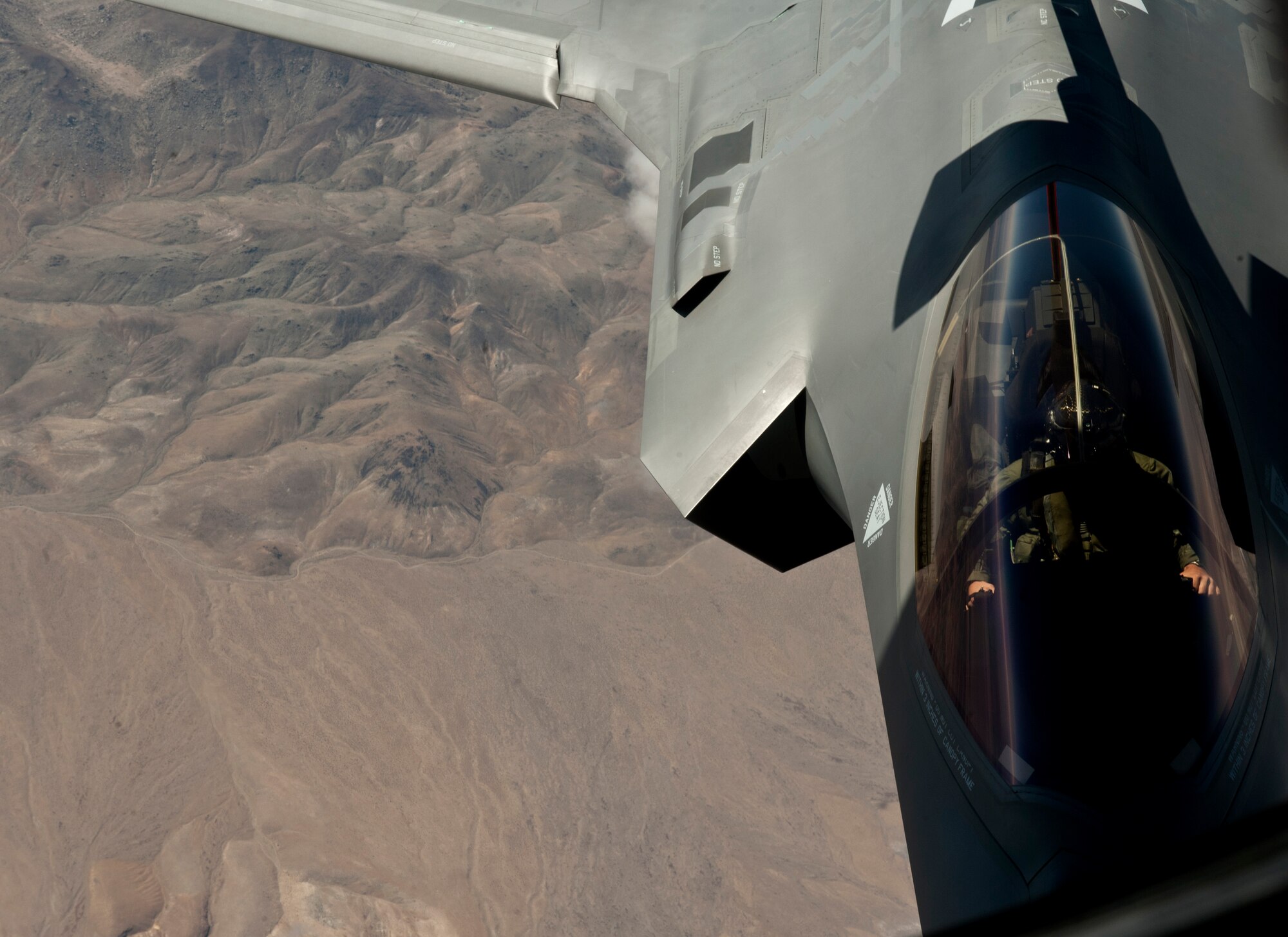 An F-35A Lightning II pilot assigned to the 31st Test and Evaluation Squadron, Edwards Air Force Base, Calif., maneuvers his aircraft into position to receive a refuel from a KC-135 Stratotanker assigned to the 927th Air Refueling Wing, MacDill AFB, Fla., during a Green Flag 15-08 training sortie in the skies over the National Training Center at Fort Irwin, Calif., June 10, 2015. Green Flag sorties are typically flown over the ranges of the NTC, where Air Force assets support Army soldiers training on the ground. (U.S. Air Force photo by Senior Airman Joshua Kleinholz)