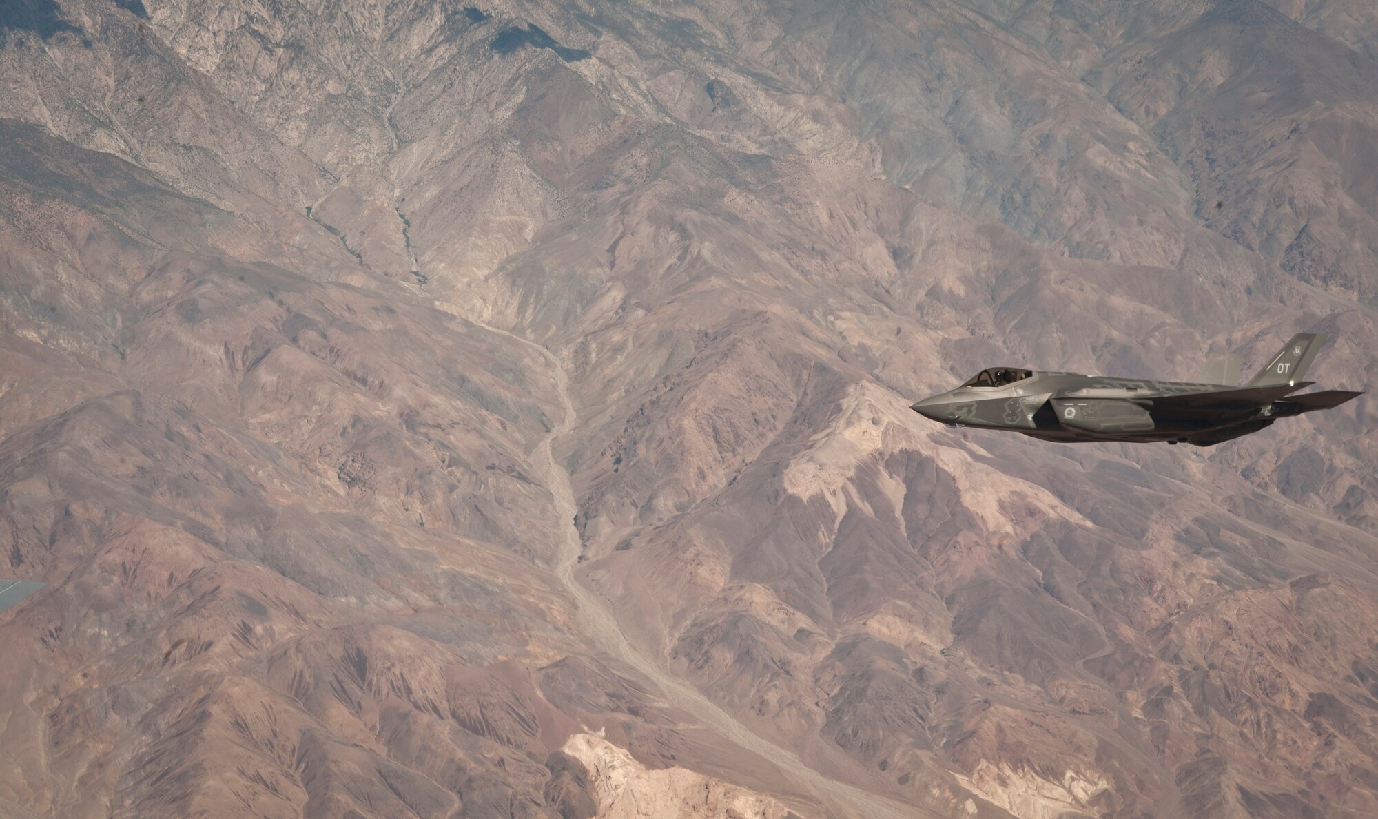 An F-35A Lightning II assigned to the 31st Test and Evaluation Squadron, Edwards Air Force Base, Calif., soars through the skies over the National Training Center at Fort Irwin, Calif., during a Green Flag 15-08 training sortie June 10, 2015. The F-35’s advanced sensor package is designed to gather, fuse and distribute more information than any fighter in history, giving operators a decisive advantage over all adversaries. (U.S. Air Force photo by Senior Airman Joshua Kleinholz)