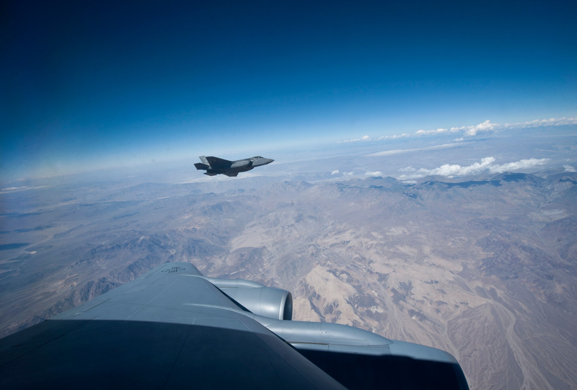 An F-35A Lightning II assigned to the 31st Test and Evaluation Squadron, Edwards Air Force Base, Calif., approaches a KC-135 Stratotanker assigned to the 927th Air Refueling Wing, MacDill AFB, Fla., for a refuel during a Green Flag 15-08 training sortie in the skies over the National Training Center, Calif., June 10, 2015. Green Flag iteration 15-08 brought about an increased role for the F-35 as it continues through its stages of operational testing. (U.S. Air Force photo by Senior Airman Joshua Kleinholz)