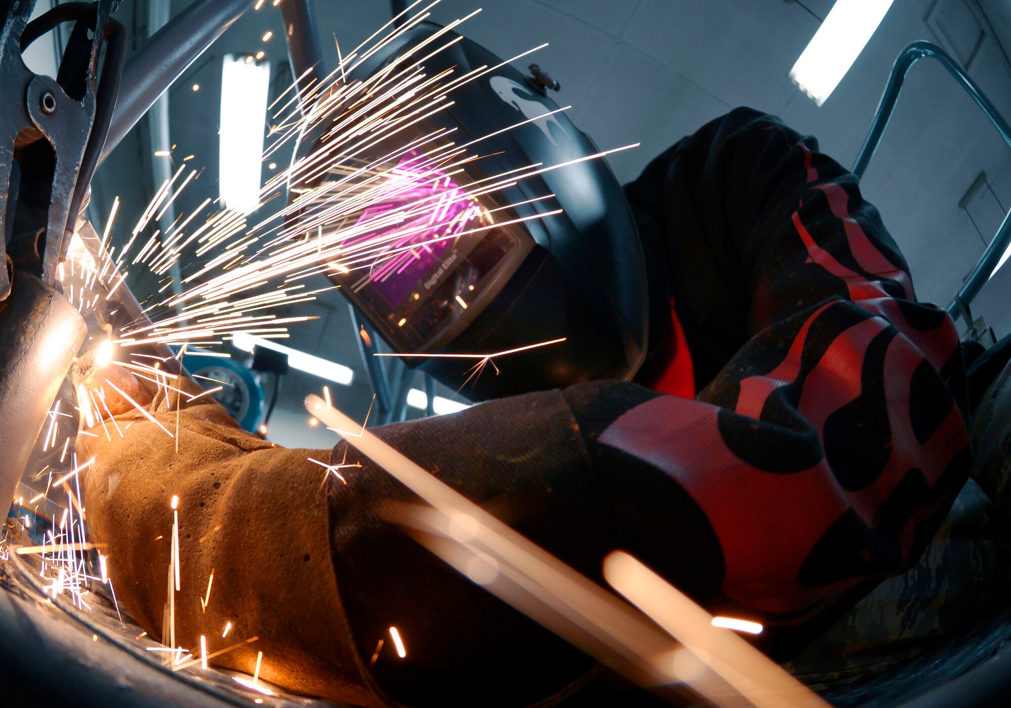 Airman 1st Class Curtis Doherty, 374th Maintenance Squadron aircraft metals technology journeyman, welds a post hole for a B-1 platform at Yokota Air Base, Japan, June 23, 2015. The average time it takes to fix or create a piece of equipment is approximately eight hours. (U.S. Air Force photo by Senior Airman David Owsianka/Released)