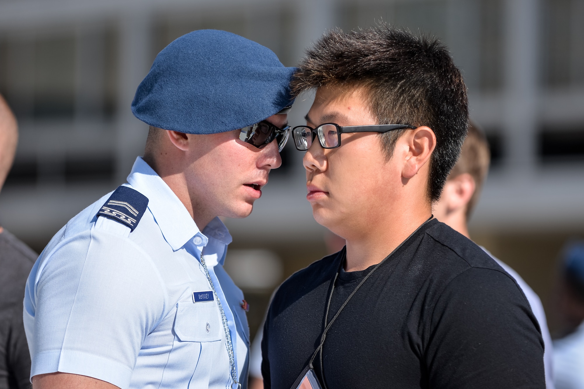 A basic cadet training cadre member gives close-up instructions to a basic cadet at the Air Force Academy June 25, 2015. More than 1,000 basic cadets processed into the Academy and began BCT, which lasts through August 1. (U.S. Air Force photo/Elizabeth Copan)