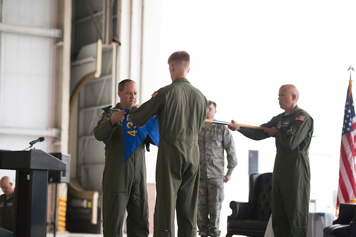 Colonel Fred Boehm and Lt. Col. Paul Theriot retire the 17th Airlift Squadron guidon flag during the squadron's inactivation ceremony June 25, 2015 at Joint Base Charleston, S.C. As part of the President’s Defense Budget for FY15, one of Charleston’s four active-duty C-17 flying squadron's was designated for inactivation. In attendance at the ceremony were many of the squadron's former commander's including Maj. Gen. (ret) Ron Ladnier, who commanded the squadron when it stood up as the first operational C-17 squadron. Boehm is the 437th Operations Group commander and Theriot is the 17th AS commander. (U.S. Air Force photo / Trisha Gallaway) 