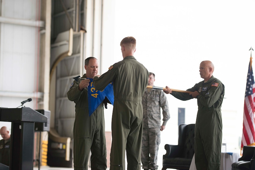 Colonel Fred Boehm and Lt. Col. Paul Theriot retire the 17th Airlift Squadron guidon flag during the squadron's inactivation ceremony June 25, 2015 at Joint Base Charleston, S.C. As part of the President’s Defense Budget for FY15, one of Charleston’s four active-duty C-17 flying squadron's was designated for inactivation. In attendance at the ceremony were many of the squadron's former commander's including Maj. Gen. (ret) Ron Ladnier, who commanded the squadron when it stood up as the first operational C-17 squadron. Boehm is the 437th Operations Group commander and Theriot is the 17th AS commander. (U.S. Air Force photo / Trisha Gallaway) 