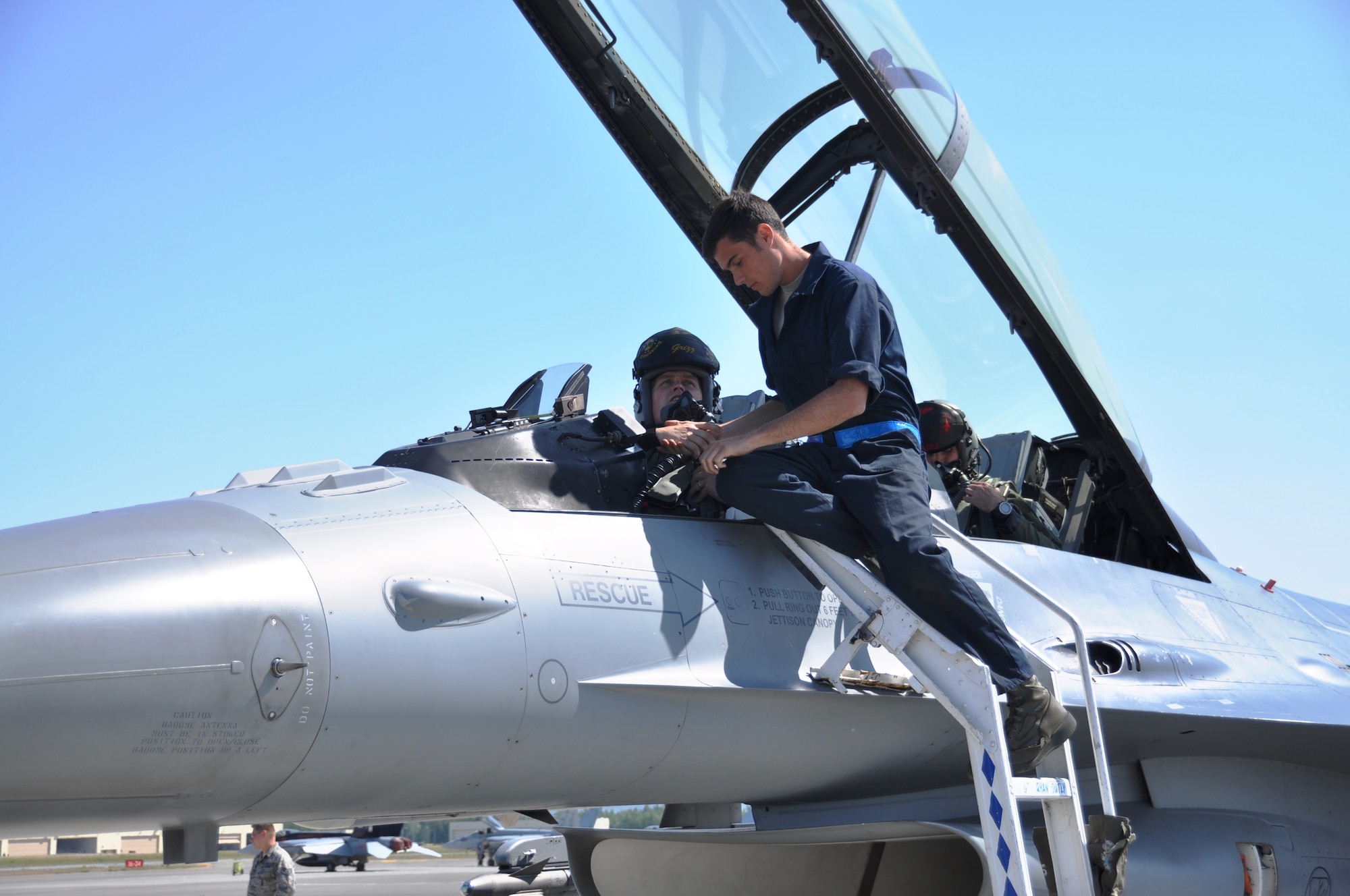 Senior Airman Jeremy Fogle, 96th Aircraft Maintenance Squadron F-16 crew chief from Nazareth, Pa., prebriefs Maj Grizz Baer, 53rd Wing F-16 pilot from Wolcott, Ind., prior to takeoff for an Exercise Northern Edge mission June 23, 2015.  Northern Edge is Alaska’s premier joint training exercise designed to practice operations, techniques and procedures as well as enhance interoperability among the services. Thousands of service members from active duty, Reserve and National Guard units are involved.  (U.S. Air Force photo/Capt. Tania Bryan)