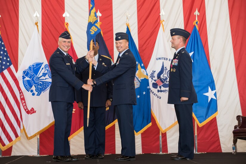 Col. Frederick D. Thaden, Joint Base McGuire-Dix-Lakehurst and 87th Air Base Wing commander, accepts the 87th ABW guidon from Maj. Gen. Frederick H. Martin, U.S. Air Force Expeditionary Center commander, upon assuming command during a ceremony held June 25, 2015 at JB MDL, N.J. Thaden comes to the joint base from serving as director of Manpower, Personnel and Services at Air Mobility Command Headquarters, Scott Air Force Base, Ill. (U.S. Air Force photo by Russell Meseroll)