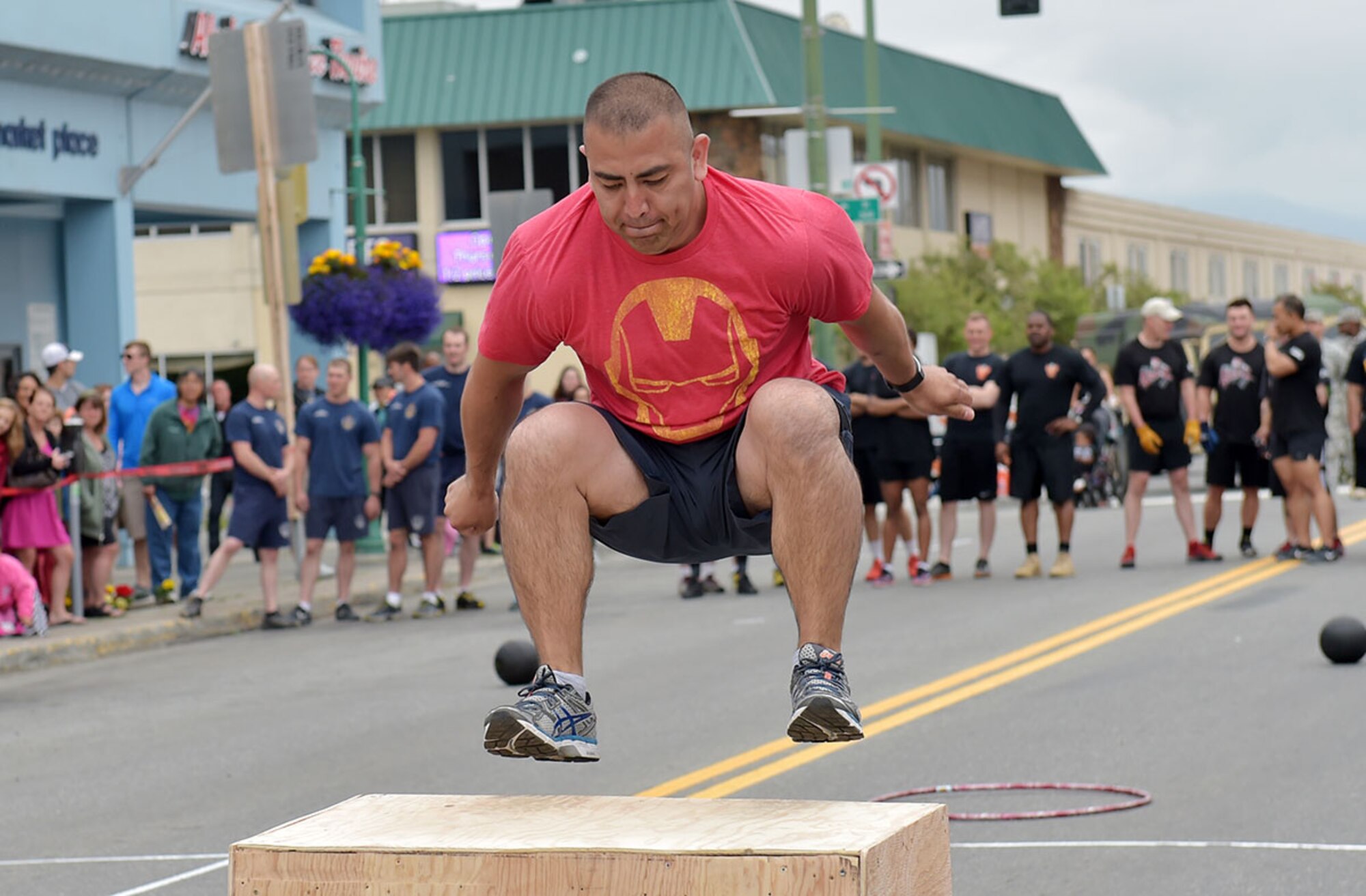 Air Force Staff Sgt. Omar Sanchez, assigned to the 673rd Medical Group, competes in the Hero Games in downtown Anchorage, Alaska, during the Solstice Celebration, Saturday, June 20, 2015. The annual competition is hosted by the Anchorage Downtown Partnership, and pits military members and local civilian firefighter teams against each other in various team-based challenges as part of a larger event celebrating the longest day of the year. (U.S. Air Force photo/Justin Connaher)