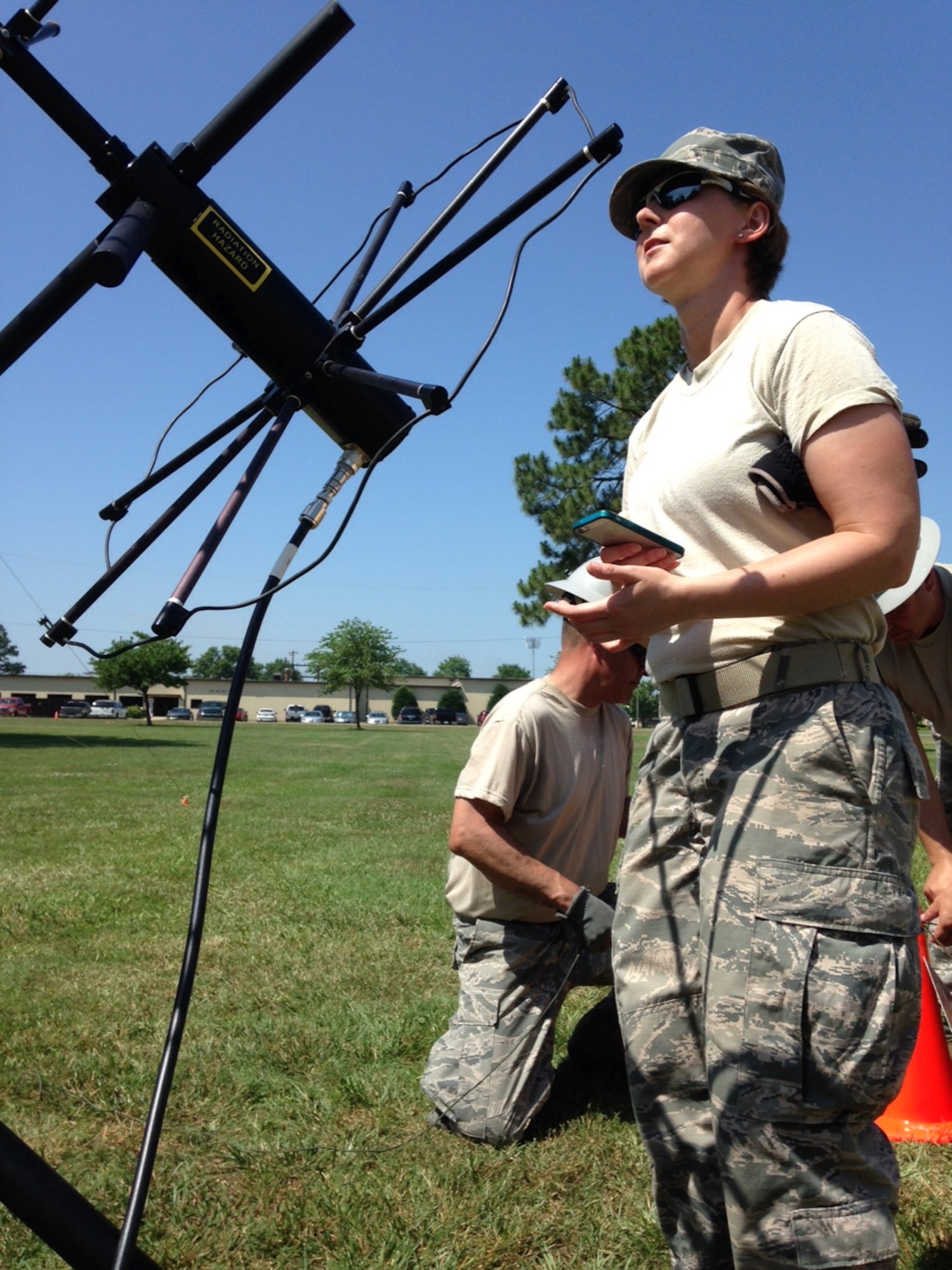 U.S. Air Force Technical Sgt. Sherry Williams, of  Fayetteville, N.C. a member of the 263rd Combat Communications Squadron, North Carolina Air National Guard, helps set up an antenna for satellite communications at Seymour Johnson Air Force Base, Goldsboro, N.C. June 15, 2015. Williams and her unit supported active duty units during exercise "Medusa Rising" as part of their 2015 annual training. (U.S. Air Force photo by Lt. Col. Robert Carver, North Carolina Air National Guard Public Affairs/Released)