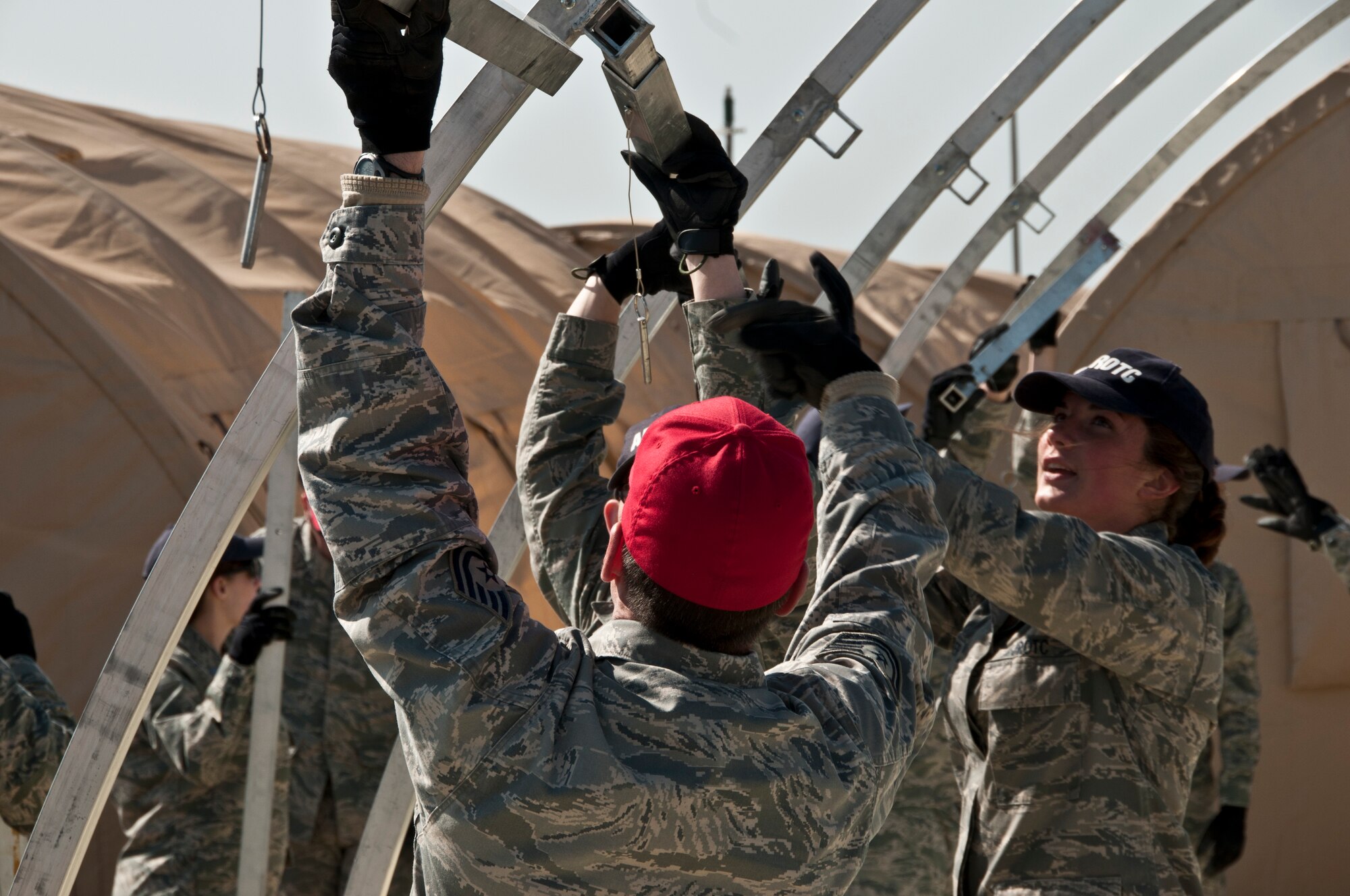 200th RED HORSE members help cadets of the Junior Reserve Officer Training Corps (AF JROTC) from Knox County, set up a deployment tent while visiting the 200th RED HORSE, Detachment 1, Mansfield, OH, April 21, 2014.  The cadets got a chance to tour the facility, learn about the mission and get hands on with equipment. (U.S. Air National Guard Photo by Tech. Sgt. Joe Harwood\Released)