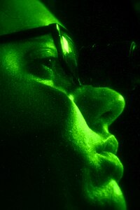 U.S. Air Force Airman 1st Class Marc Tinker, 1st Operations Support Squadron aircrew flight equipment journeyman, calibrates a pair of night vision goggles at Langley Air Force Base, Va., June 18, 2015. The AFE technicians test every pair of NVGs to ensure each is aligned and fully adjustable for anyone with up to 20-20 vision. (U.S. Air Force photo by Airman 1st Class Devin S. Michaels/Released)