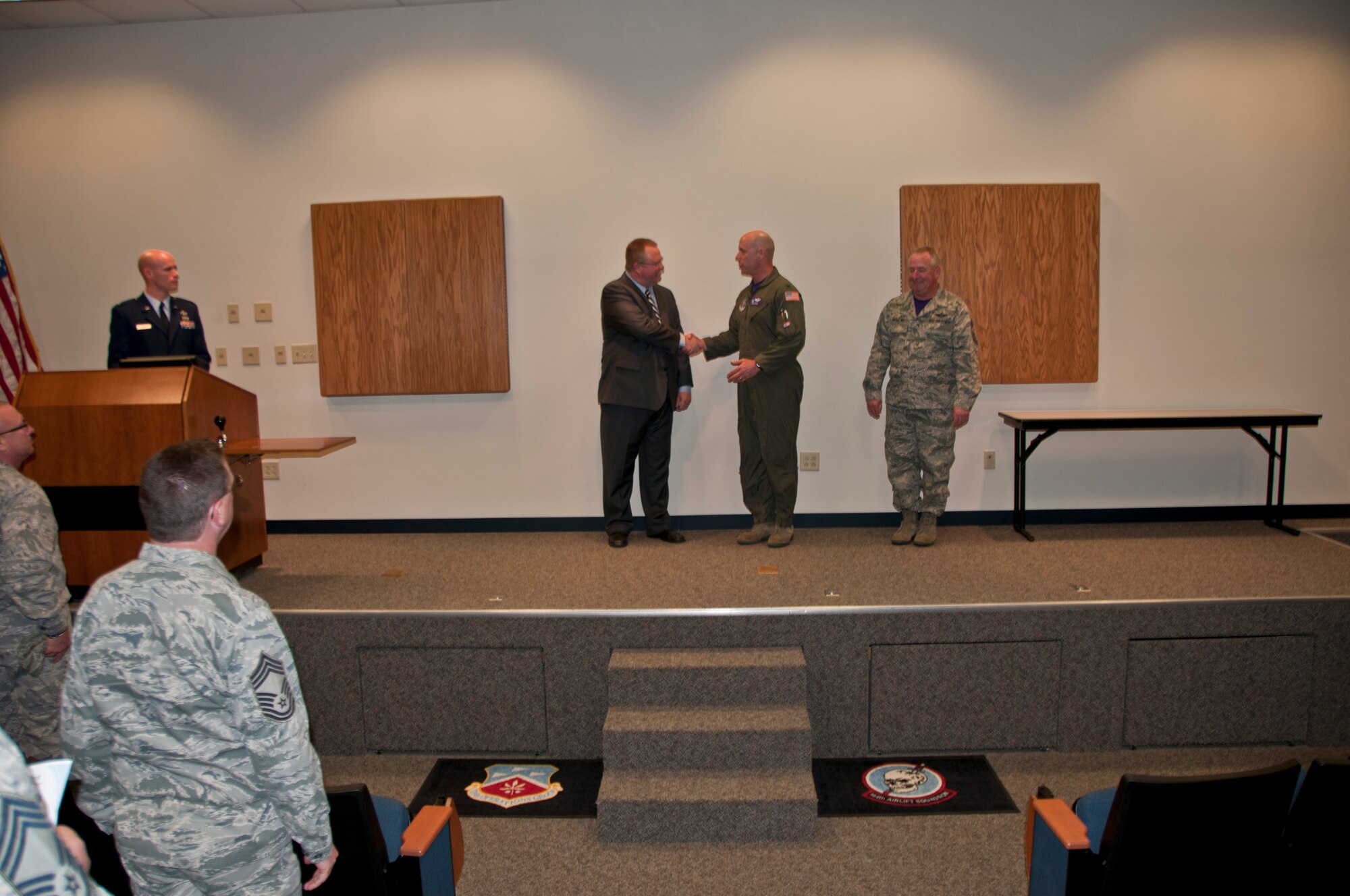 Members of the 179th Airlift Wing gather to congratulate airmen who have accomplished their Community College of the Air Force degree in Mansfield, OH, Apr. 12, 2015. Special guest speaker, Mansfield City Schools Superintendent, Brian K. Garverick, speaks about the different paths people can take and how much education paves the way.  (U.S. Air National Guard Photo by Tech. Sgt. Joe Harwood\Released)