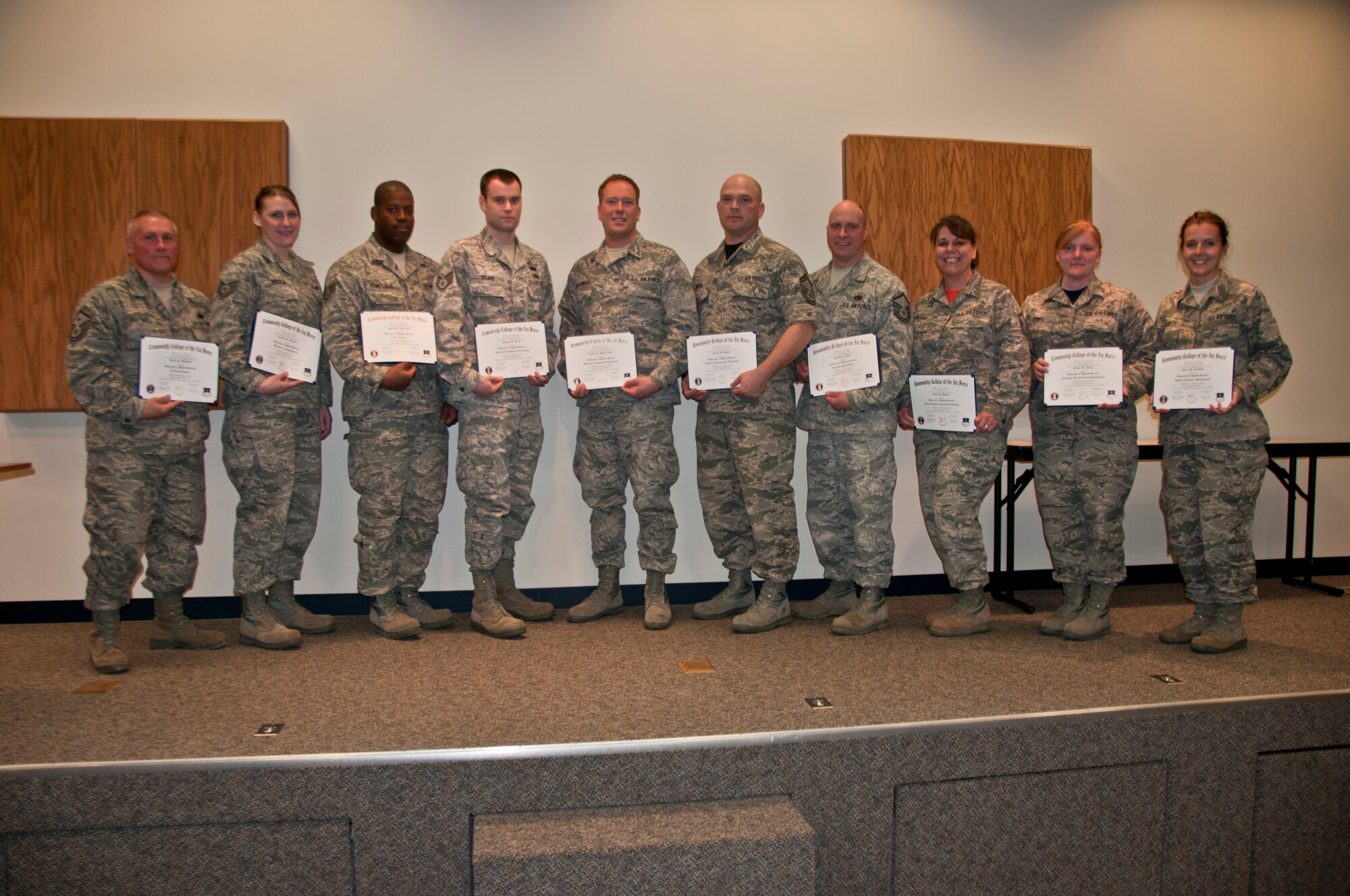 Members of the 179th Airlift Wing gather to congratulate airmen who have accomplished their Community College of the Air Force degree in Mansfield, OH, Apr. 12, 2015. Special guest speaker, Mansfield City Schools Superintendent, Brian K. Garverick, speaks about the different paths people can take and how much education paves the way.  (U.S. Air National Guard Photo by Tech. Sgt. Joe Harwood\Released)