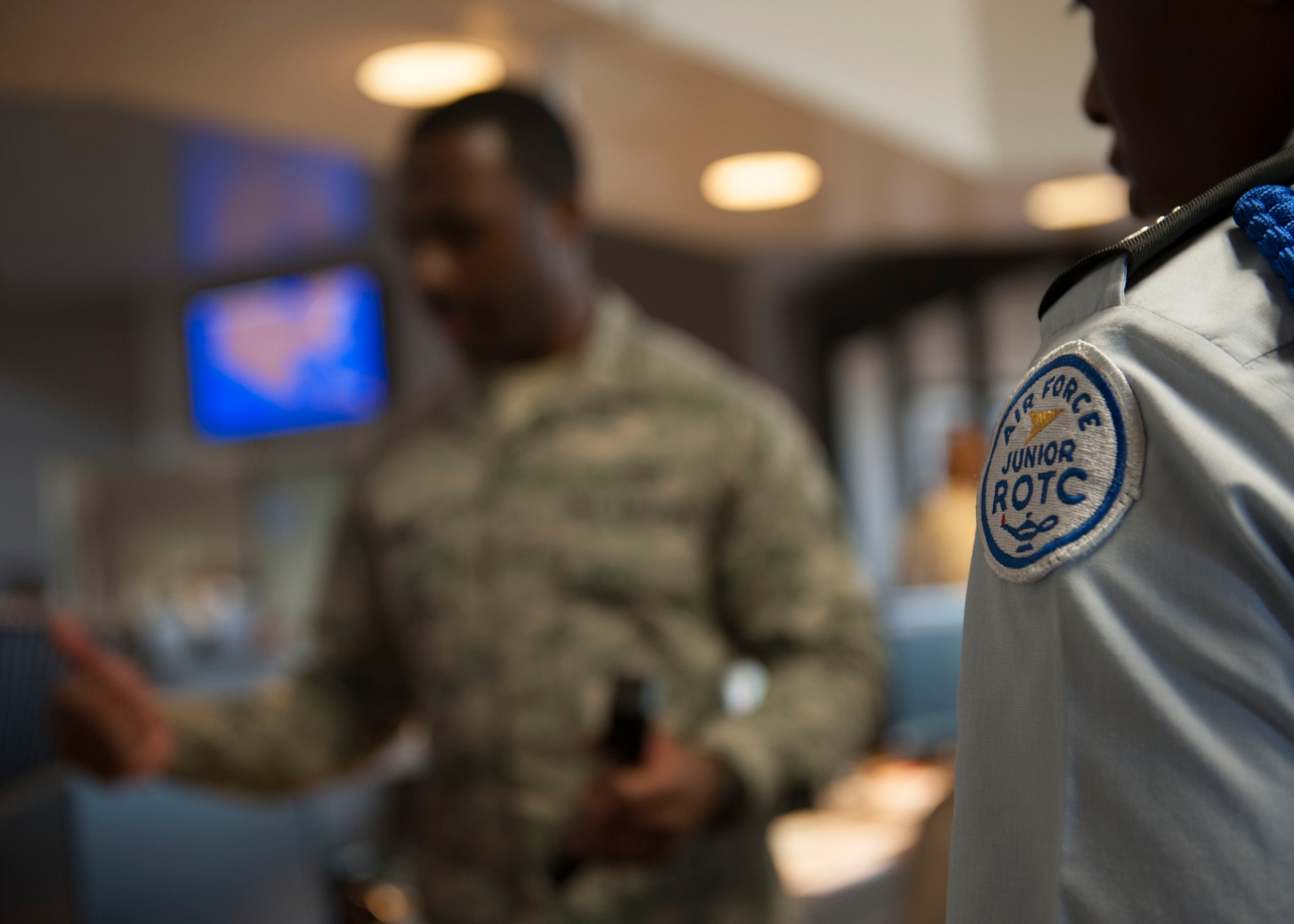U.S. Air Force Senior Airman Brandon Burns, 1st Operations Support Squadron airfield management shift lead, explains proper flight plan procedures to Junior ROTC cadets during Shadow Day at Langley Air Force Base, Va., June 23, 2015. Burns manages airfield operations to ensure a safe, efficient and effective airfield environment by inspecting runways, taxiways, parking aprons, pavements, arresting systems, signs, lighting and airfield clearance areas. (U.S Air Force photo by Staff Sgt. John D. Strong II/ Released)