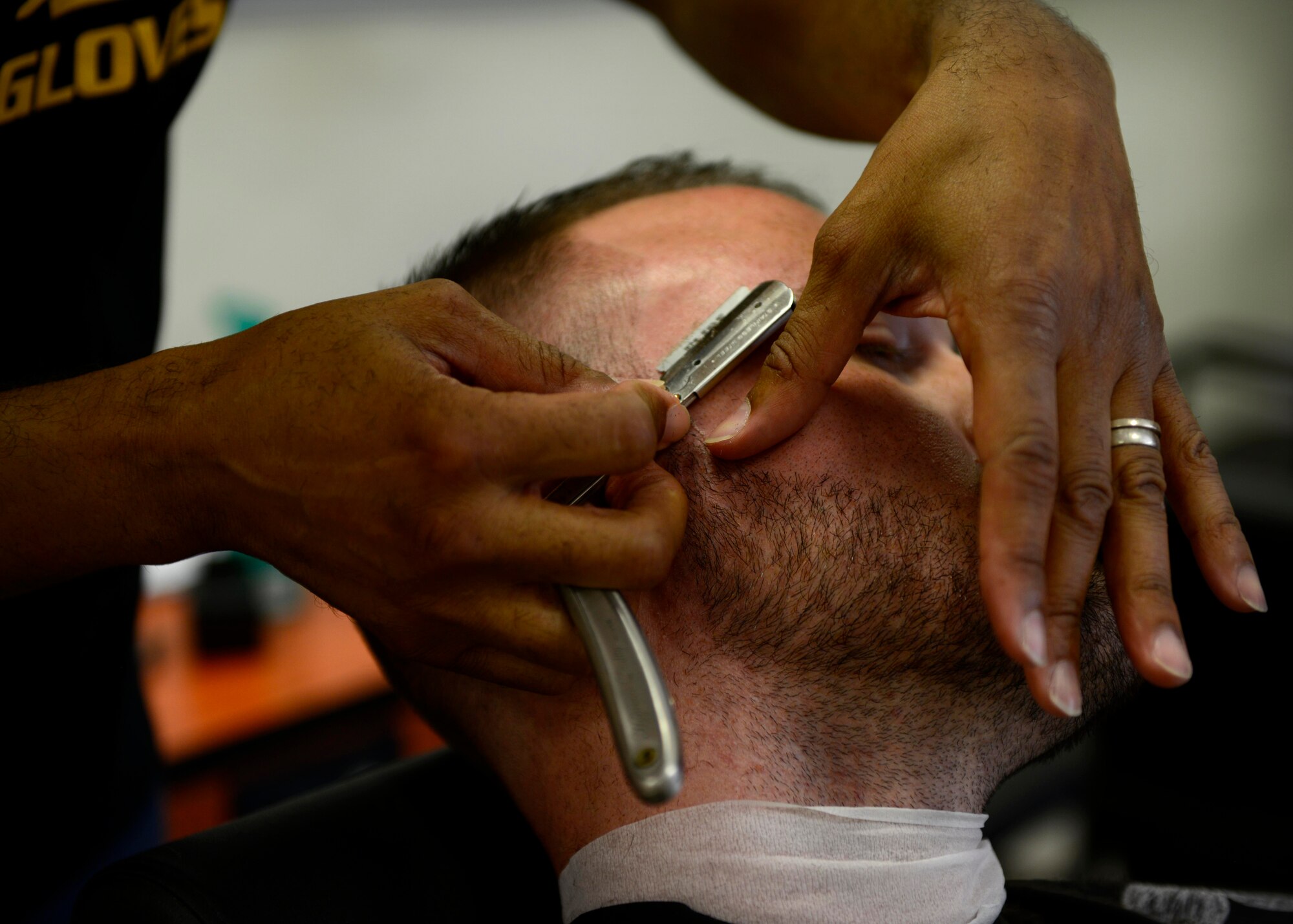 Eric Morris Santiago, local barber, prepares to cut a customer’s hair, June 25, 2015, at Aviano Air Base, Italy. The former U.S. Air Force logistics readiness supply Airman, credits his upbringing and his military service for inspiring his future goals. He hopes to open his own barbershop in New York City, next year. (U.S. Air Force photo by Senior Airman Areca T. Wilson/Released)