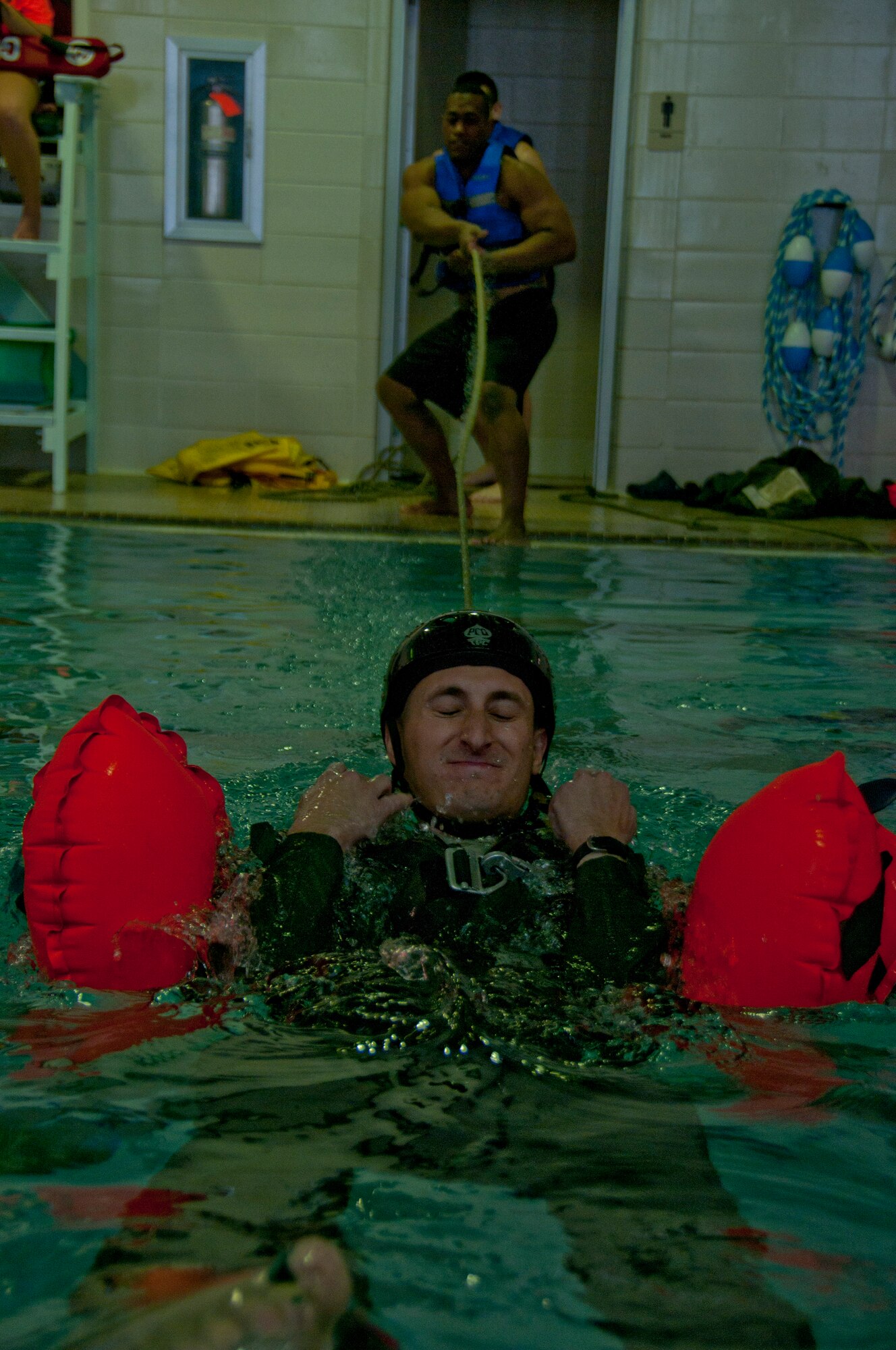 Members of the 164th Airlift Squadron, Mansfield, Ohio, perform annual water survival refresher training April 12, 2015, at the YMCA in Galion, Ohio. The 275th Akron Canton Flying Squadron of the Civil Air Patrol joined the training for the first time. (U.S. Air National Guard Photo by Tech. Sgt. Joe Harwood\Released)