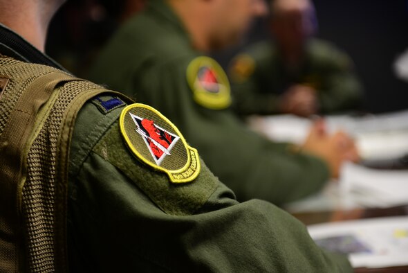 Aircrew from the 96th Bomb Squadron attend a pre-departure briefing for Exercise Northern Edge 2015 on Barksdale Air Force Base, La., June 22, 2015. The exercise is designed to sharpen U.S.  tactical combat skills, improve control and communication between forces, and to develop interoperable plans across the joint force. (U.S. Air Force photo/Airman 1st Class Luke Hill)