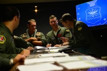 Aircrew from the 96th Bomb Squadron have a discussion after a pre-departure briefing for Exercise Northern Edge 2015 on Barksdale air Force Base, La., June 22, 2015. Northern Edge is a joint training exercise involving all military branches and prepares joint forces to respond to crises in the Indo-Asia-Pacific region. (U.S. Air Force photo/Airman 1st Class Luke Hill)