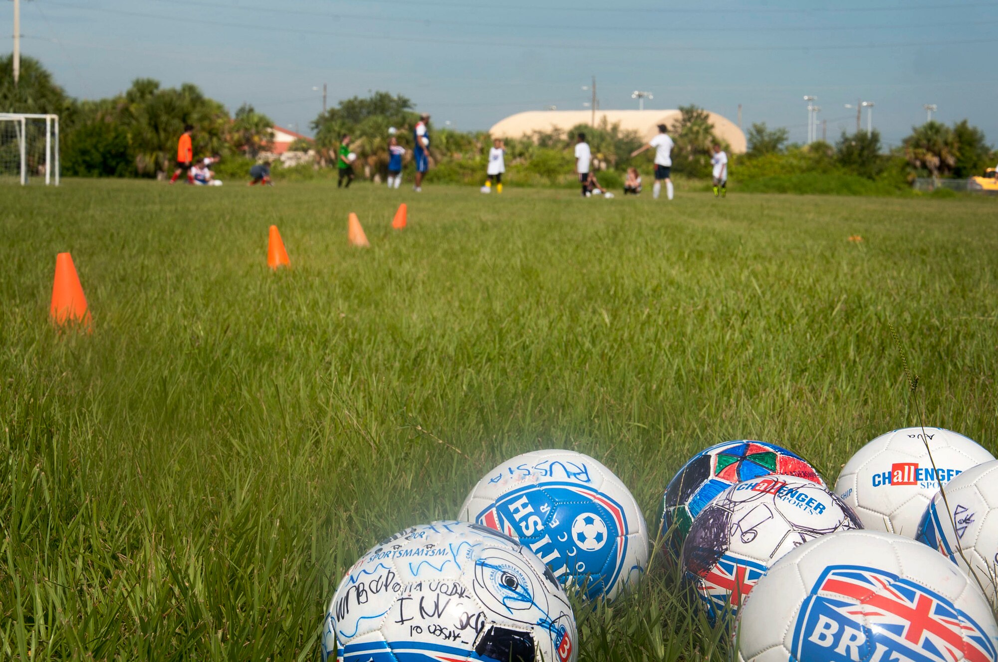 MacDill Youth Center Program offers a British Soccer Camp June 23, 2015, at MacDill Air Force Base, Fla. This week-long  camp is offered to children ages three through 18 and teaches the children fundamental soccer skills. (U.S. Air Force photo by Senior Airman Jenay Randolph/Released)