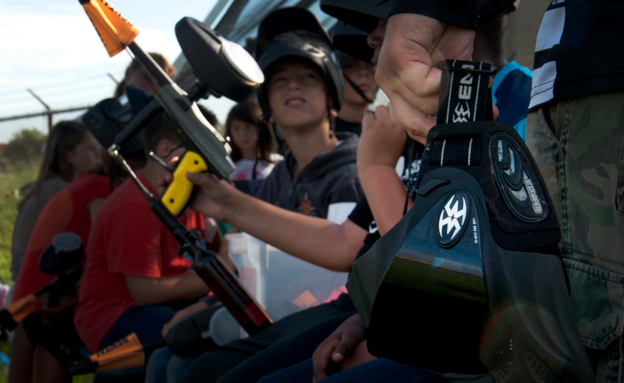 Children participating in a Paintball Camp listen to instructions before taking the field June 23, 2015, at MacDill Air Force Base, Fla. Children nine through 12 participated in the morning, while ages 12 and up participated in the afternoon. (U.S. Air Force photo by Senior Airman Jenay Randolph/Released)